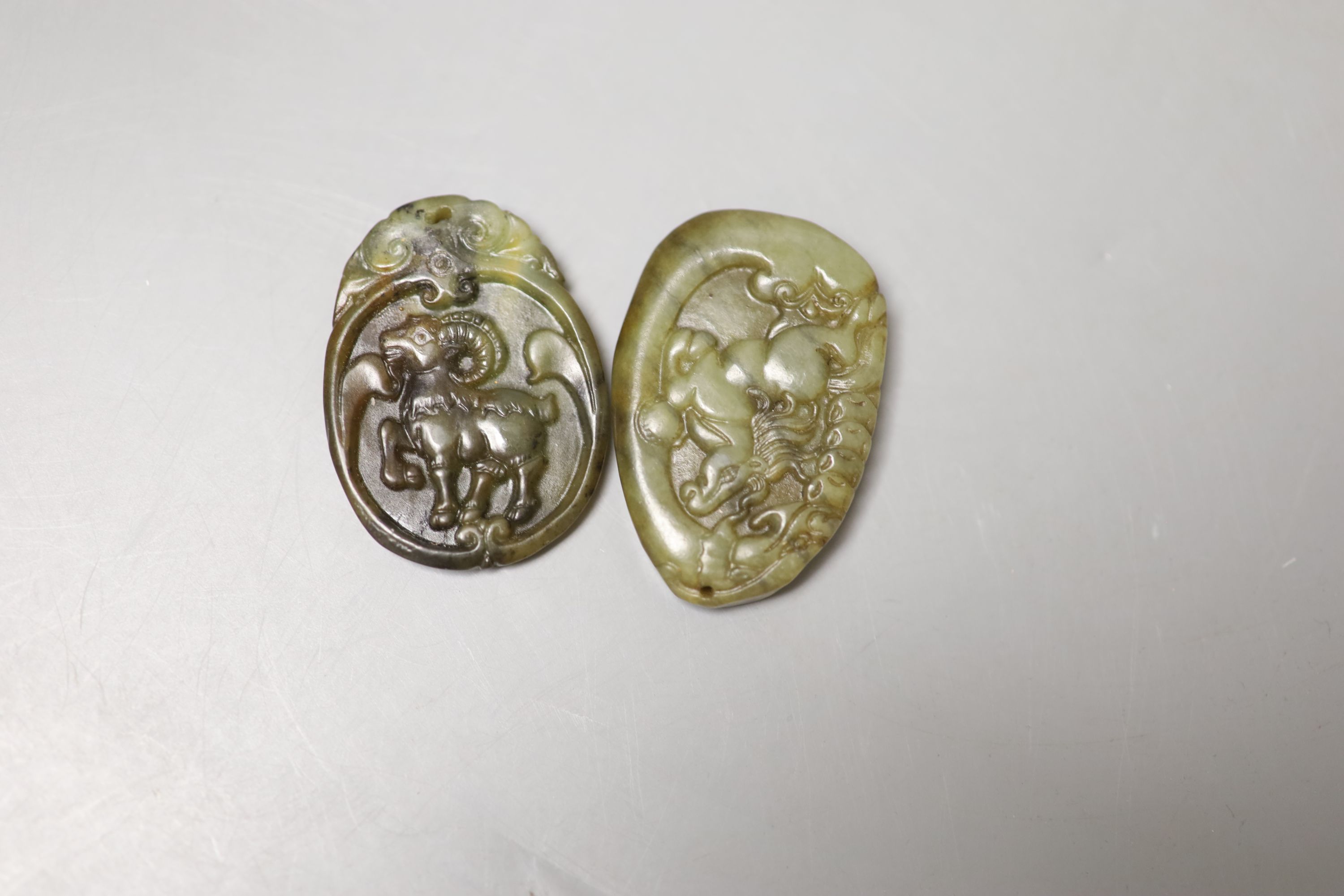 Eight Chinese hardstone pendants